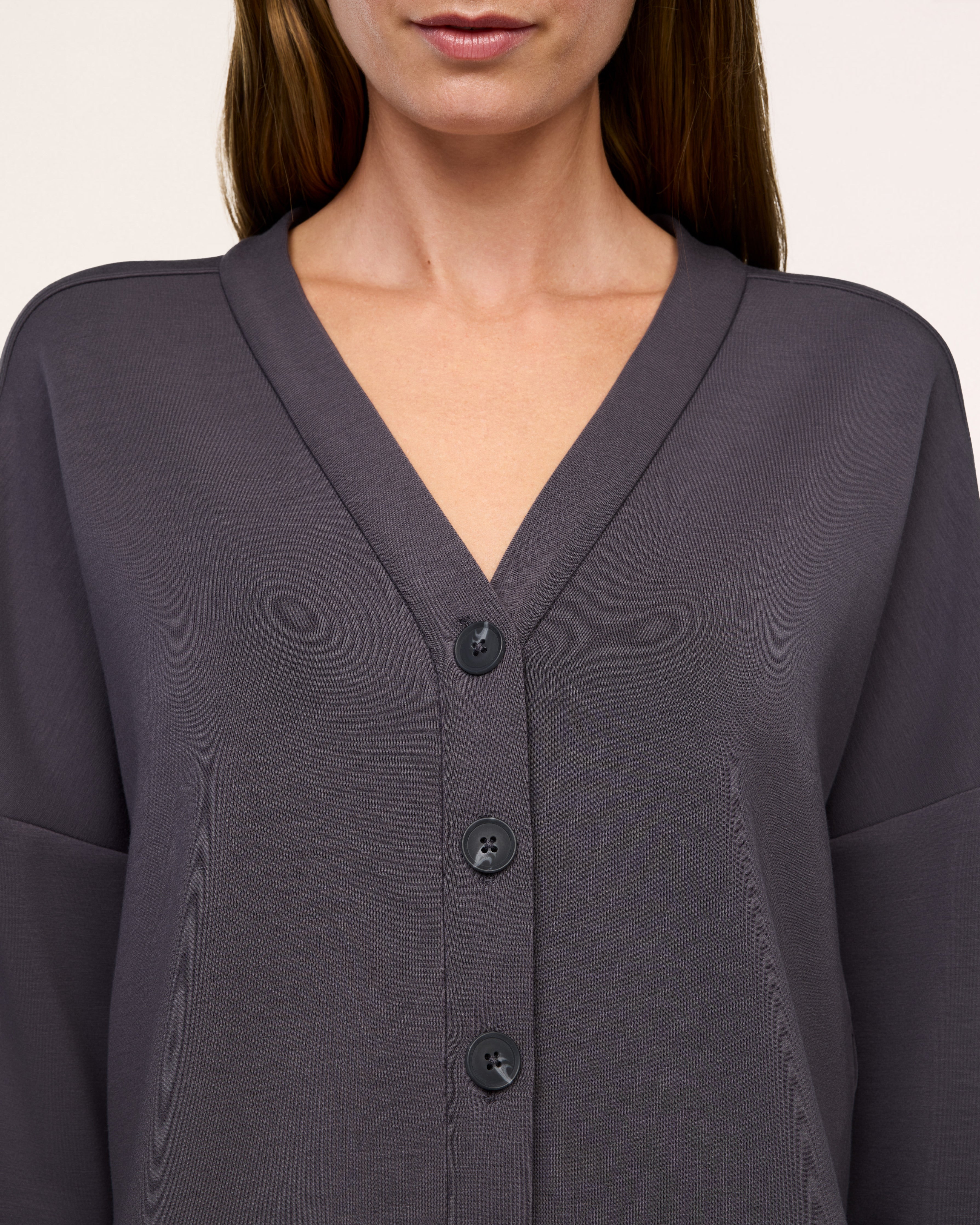 Close-up of the V-neckline and buttons on the SPANX AirEssentials Cardigan in Dark Slate gray