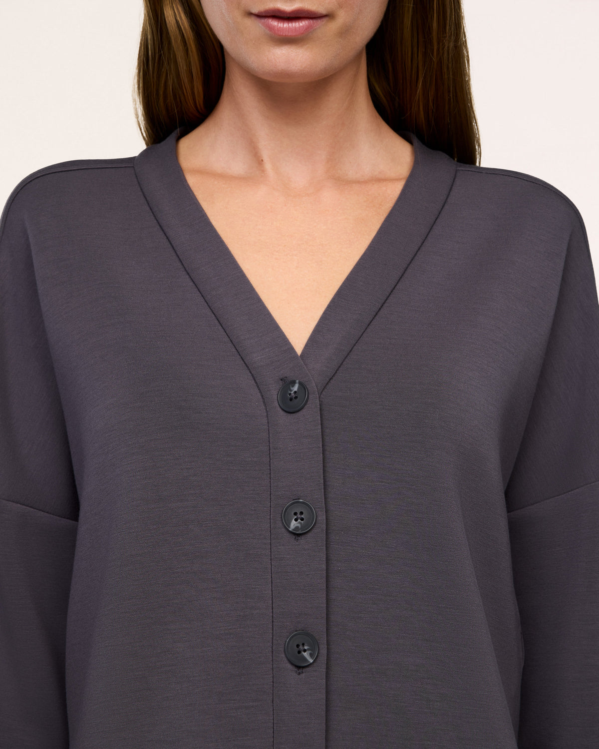 Close-up of the V-neckline and buttons on the SPANX AirEssentials Cardigan in Dark Slate gray