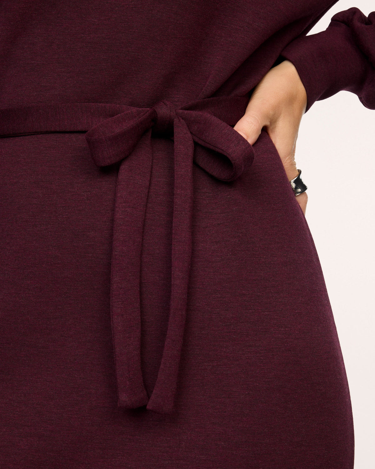 Close-up of the self-tie waist on the SPANX AirEssentials Long Sleeve Maxi Dress in Fig Noir Heather