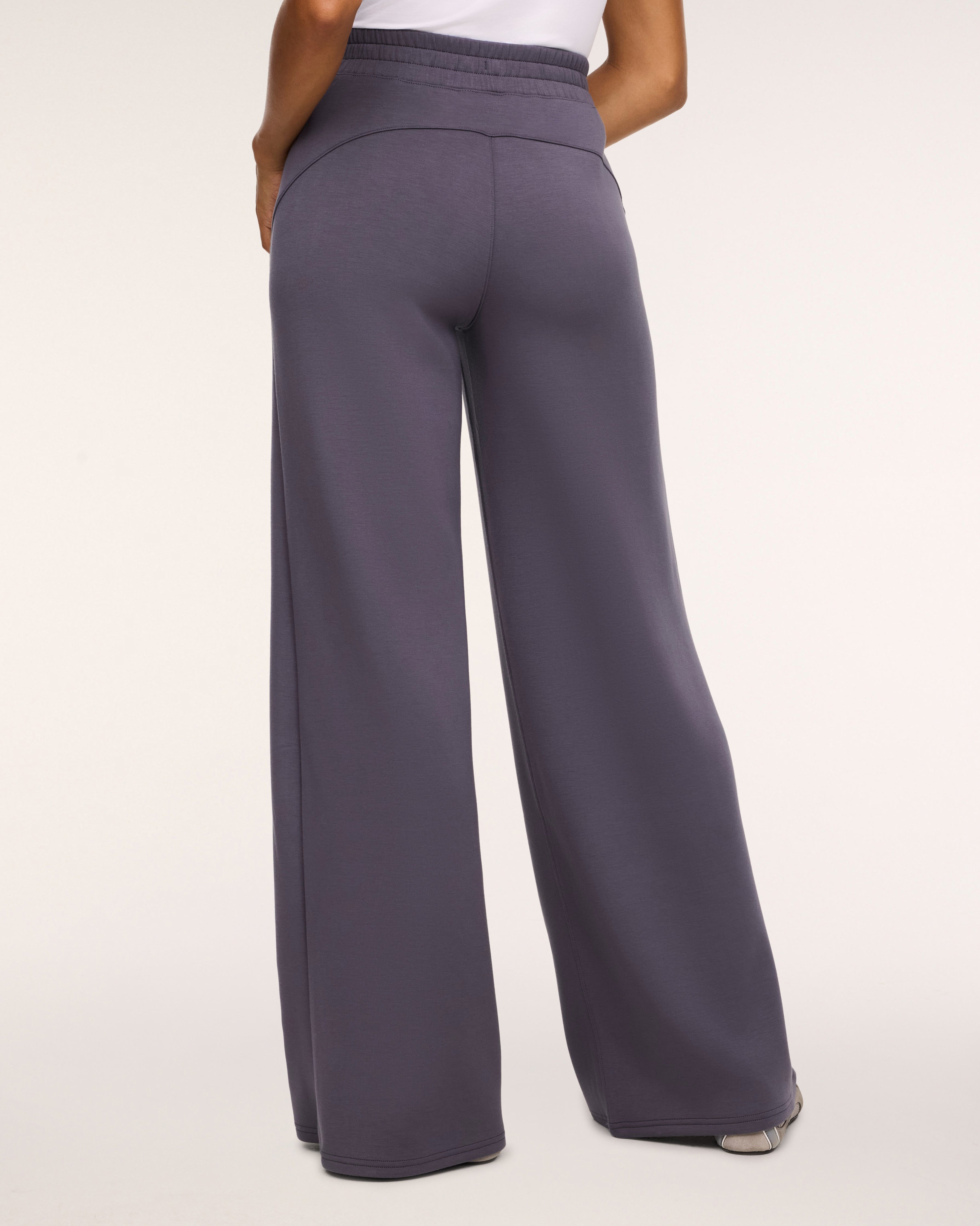 SPANX AirEssentials Wide Leg Pant in Dark Slate gray, back view showing the relaxed drape through the leg