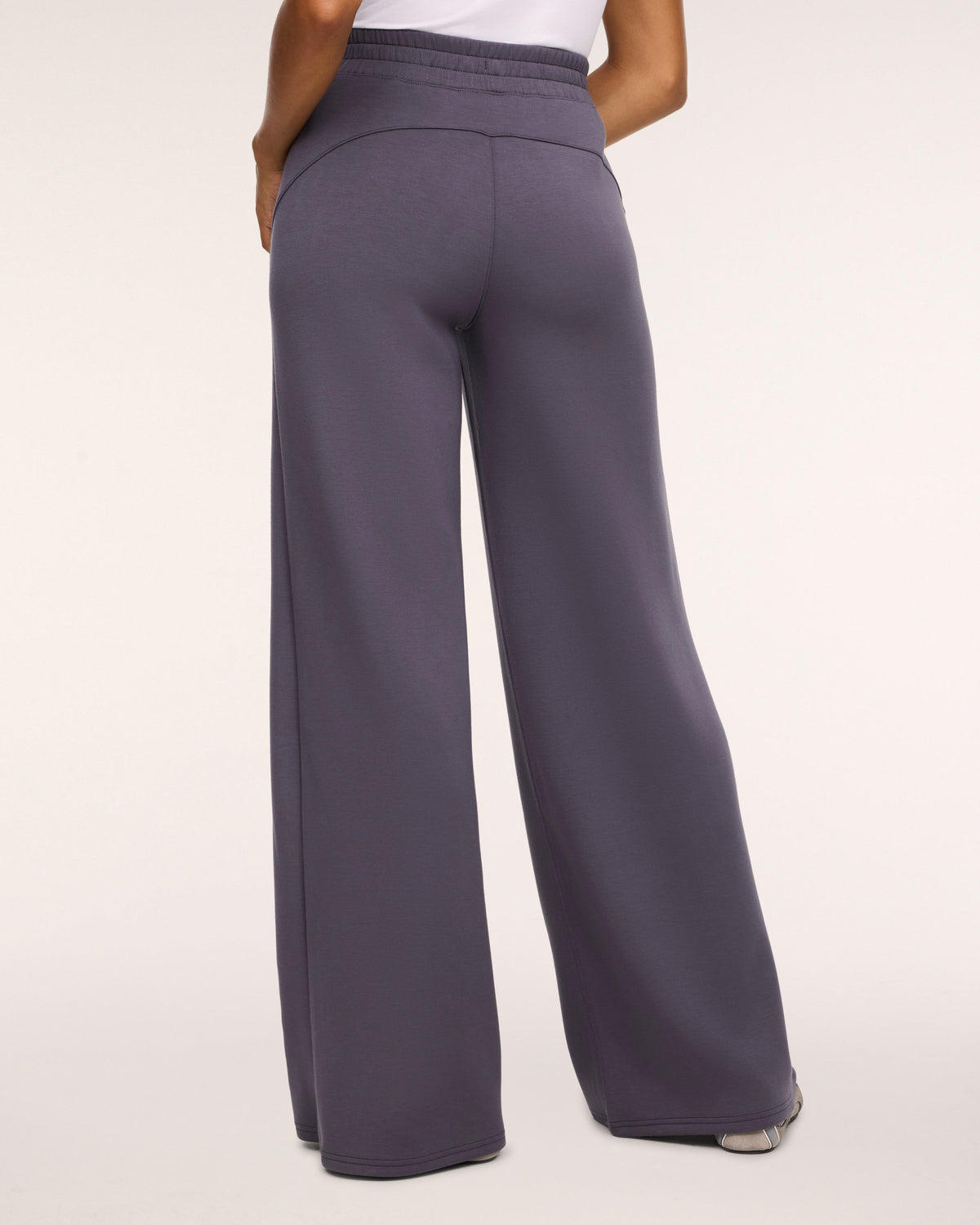 SPANX AirEssentials Wide Leg Pant in Dark Slate gray, back view showing the relaxed drape through the leg