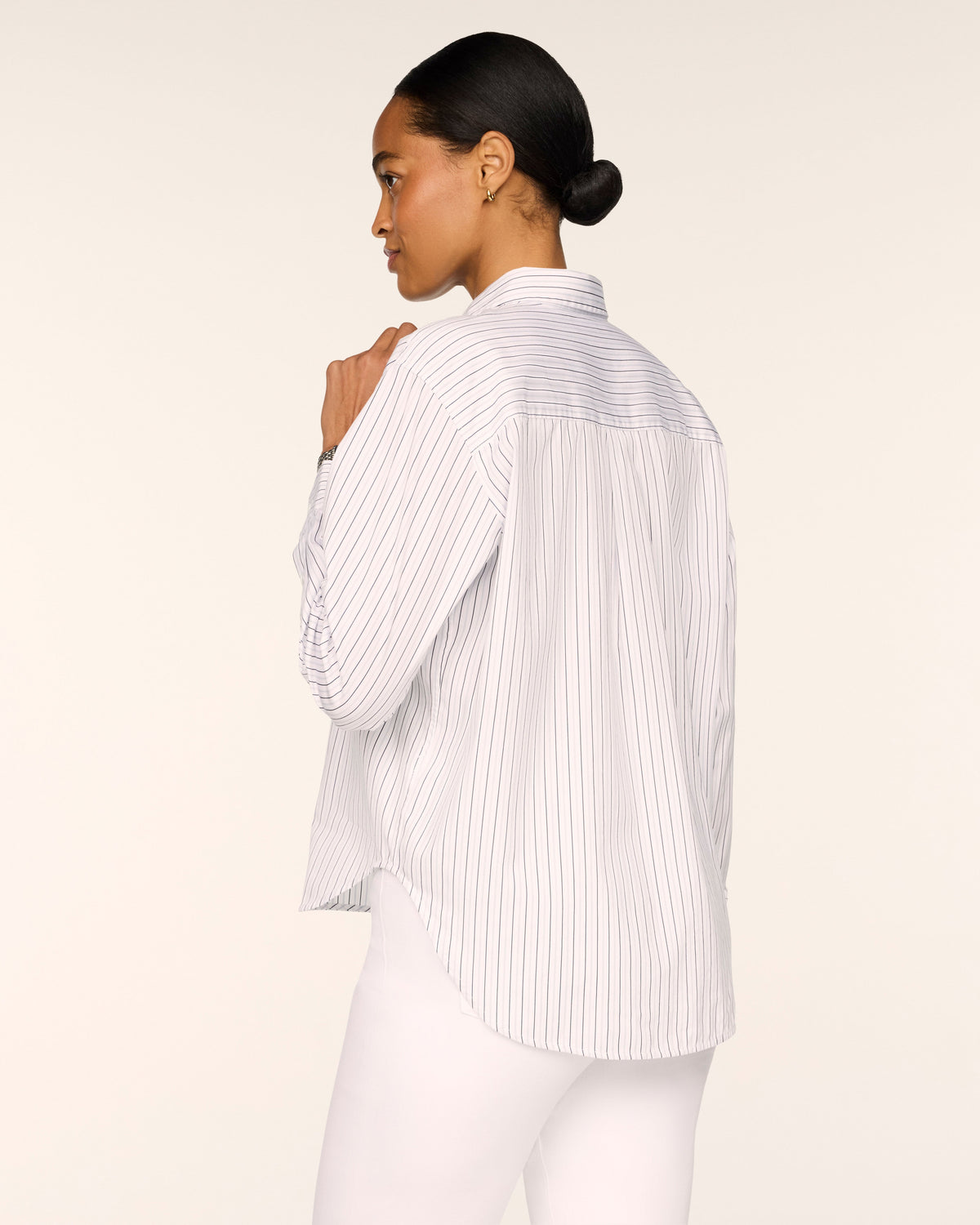 SPANX Poplin Oversized Button-Up Shirt in Dusk Daydream and white stripe, back view showing the pleated back and high-low hem