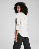 SPANX Silky Smooth Button Down in Birch soft ivory, back view showing the curved high-low shirttail hem