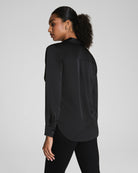 SPANX Silky Smooth Button Down in Classic Black, back view with relaxed drape and shirttail hem
