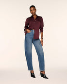 SPANX Silky Smooth Button Down in Fig Noir deep wine, half-tucked into straight leg jeans with black heeled boots, full-length view