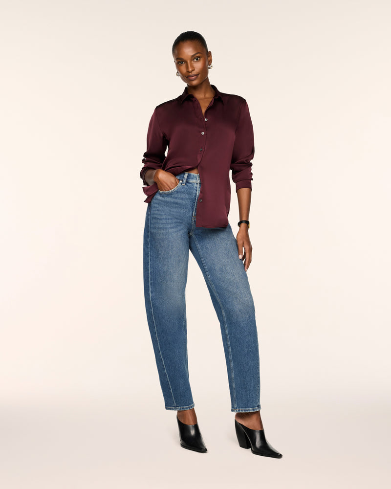 SPANX Silky Smooth Button Down in Fig Noir deep wine, half-tucked into straight leg jeans with black heeled boots, full-length view