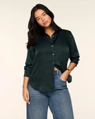 SPANX Silky Smooth Button Down in Night Forest deep green, half-tucked into jeans, front view