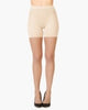 SPANXshape Mid-Thigh Sheers in Bisque, front view on model showing the sheer leg and mid-thigh shaper
