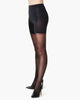 SPANXshape Mid-Thigh Sheers in Black, full-length front view on model with pumps