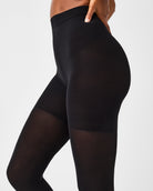 SPANXshape Mid-Thigh Tight-End Tights in Very Black, side view of the smooth high waistband and opaque leg