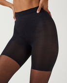 SPANXshape Original Footless Sheers in Black, front close-up of the tummy panel and mid-thigh shaper