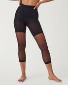 SPANXshape Original Footless Sheers in Black, full-length front view with footless capri leg