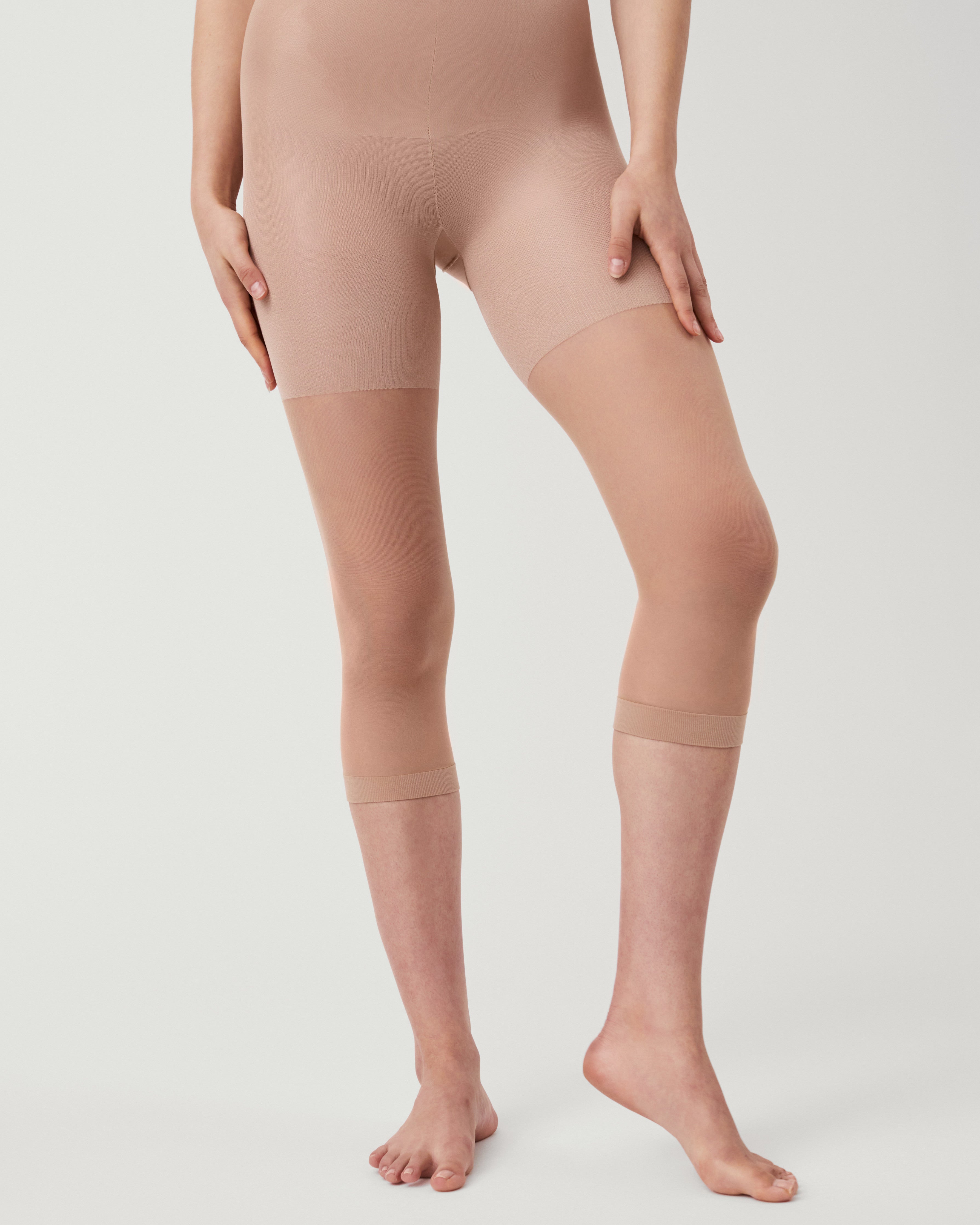 SPANXshape Original High-Waisted Footless Sheers in a nude shade, front view with high waistband and footless capri leg