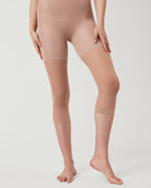 SPANXshape Original High-Waisted Footless Sheers in a nude shade, front view with high waistband and footless capri leg