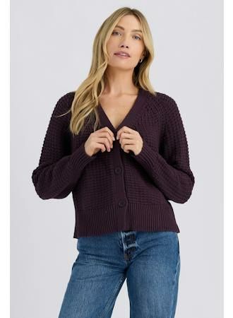 Model wearing the Stitches + Stripes Gian Cardigan, plum waffle-knit V-neck button cardigan with jeans