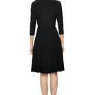 Surplice V-Neck Tie Waist Flowy Dress in Black, back view