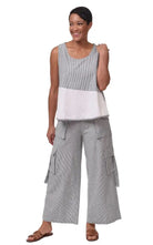 woman wearing tank top white and ticking
