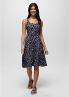 Woman wearing a patterned dress on a white background