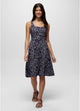 Woman wearing a patterned dress on a white background