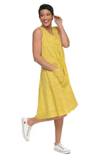 Tulip Clothing Women's Poppie Dress in Goldfish, woman wearing a yellow sleeveless midi dress with a white polka dot print and white sneakers, on a white background