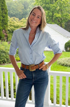 Tyler Böe Natalie Sateen Shirt in blue, styled outdoors with jeans and a belt