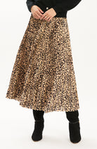 Tyler Böe Pleated Animal Print Midi Skirt worn with black boots, front view