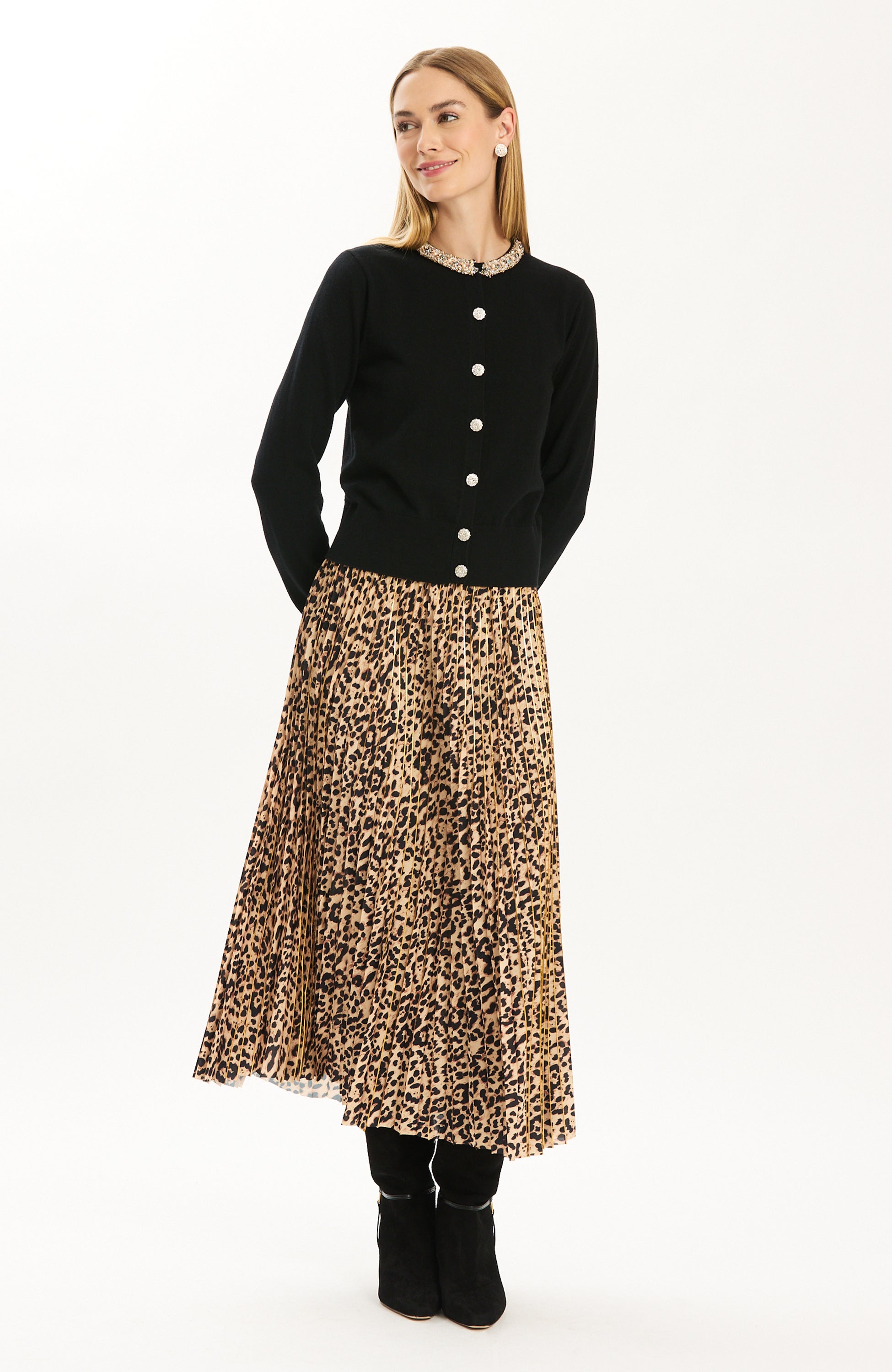 Tyler Böe Pleated Animal Print Midi Skirt styled with a black cardigan and boots