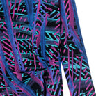 Close-up of top with a vibrant, multicolored pattern on a white background