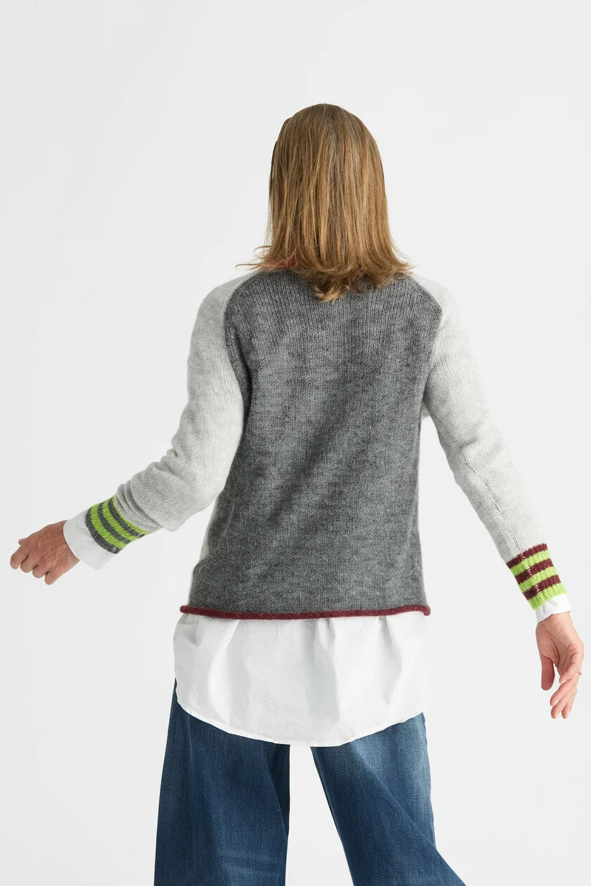 Back view of the Zaket & Plover Studio Pop Sweater in Lt Marl with grey raglan sleeves and striped cuffs, layered over a white shirt